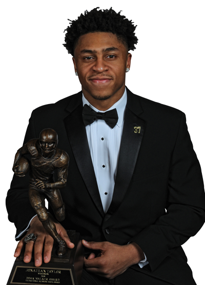 Jonathan Taylor, wearing a tuxedo while holding the Doak Walker Award